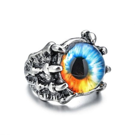 A silver ring featuring a detailed eye design with a multicolored iris, a variation of the evil eye ring.