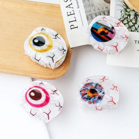 Four colorful Evil Eye claw clips, perfect as fashionable accessories.
