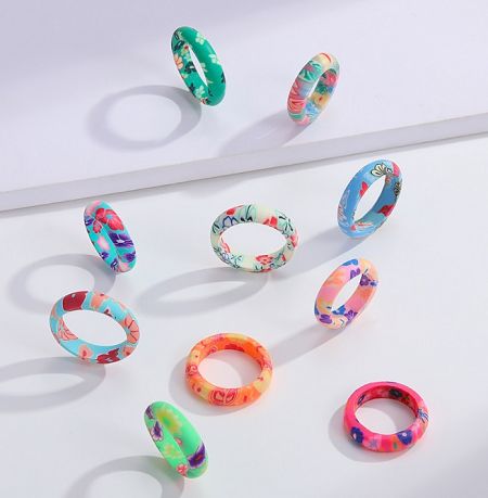 A collection of colorful floral bracelets from the same summer collection as the Cartoon Flower rings.