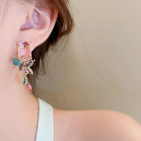 Close-up view of the stylish multi-color gemstone earrings.