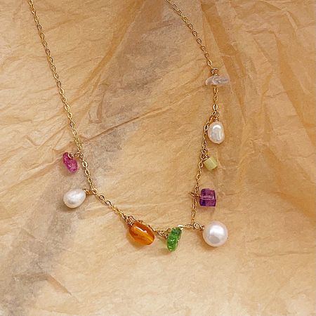 Detailed view of the colorful gemstone and pearl necklace, highlighting the unique bead combination.