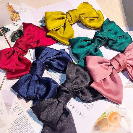 Sweet & Cute Large Bow Fabric Hair Clips - A vibrant collection of sweet and cute large fabric hair bows in multiple colors, displayed neatly for wholesale by JR Fashion Accessories.