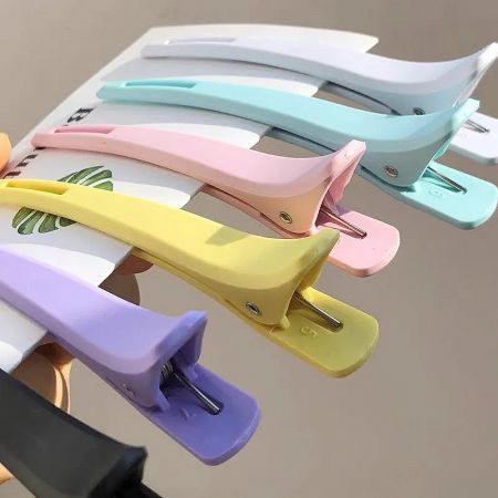 An artistic arrangement of various colored duck beak hair clips.