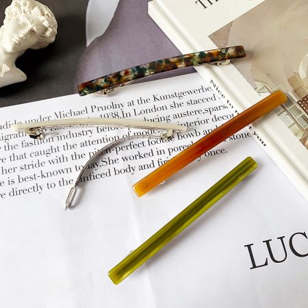 Long Acetate Stick Hair Barrette Clips (Set of 5) - A vibrant collection of long acetate stick hair barrette clips in various colors, stylishly arranged for a product showcase.