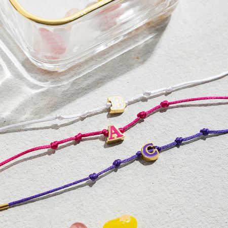 Wholesale Enamel Letter Friendship Bracelets 18K Gold Plated Stainless Steel - A vibrant collection of 18K gold-plated stainless steel friendship bracelets featuring colorful enamel initial charms 'A', 'B', and 'C', perfect for wholesale and personalized jewelry.