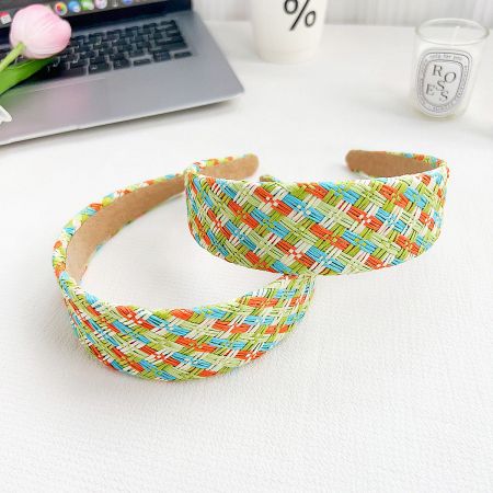 Two vibrant multicolor hand-woven raffia headbands.