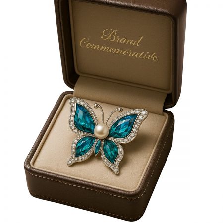 A commemorative butterfly brooch displayed in a luxury jewelry box, showcasing its elegant design.