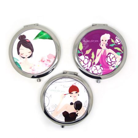 Wholesale Stainless Steel Compact Mirrors with Custom Logo - Three stainless steel compact mirrors with custom cartoon designs, showcasing options for bulk orders from JR Fashion Accessories.