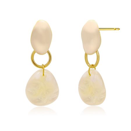 A close-up view of the Bella Dangle Earrings, showcasing the modern minimalist design with cream-colored material and gold metal components.