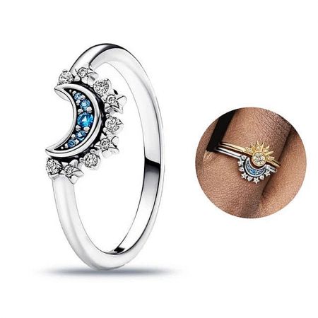 Close-up of the crescent moon and star ring, adorned with blue and clear zircon stones, part of the celestial harmony set.