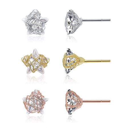 Detailed view of the tri-tone star CZ stud earrings, showcasing the intricate metal lattice design.