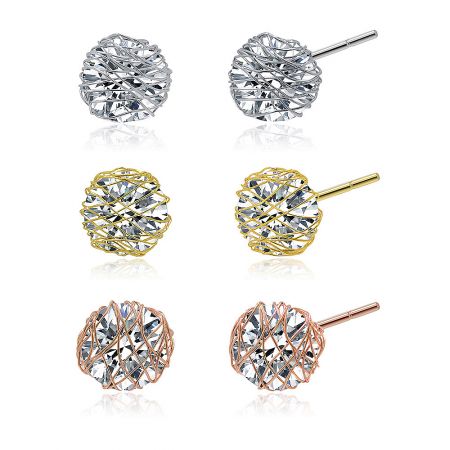 Detailed shot of the sparkling crystal in a delicate lattice setting on the three-tone stud earrings.