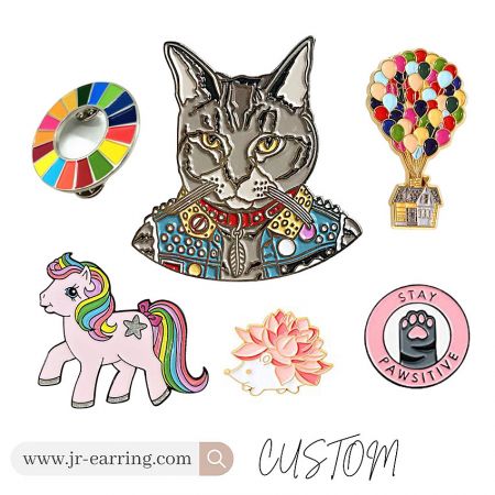 A colorful assortment of custom enamel pins featuring animal, abstract, and motivational themes.