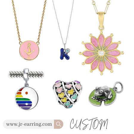 A diverse collection of custom enamel jewelry charms, including nautical and floral designs.