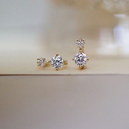 Elegant display of the mini crystal huggies hoop earrings, highlighting their minimalist design.