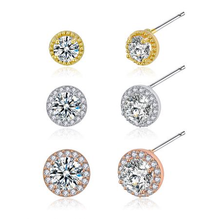 Close-up of the six individual pave CZ stud earrings from the tri-tone set, highlighting the sparkling stones.