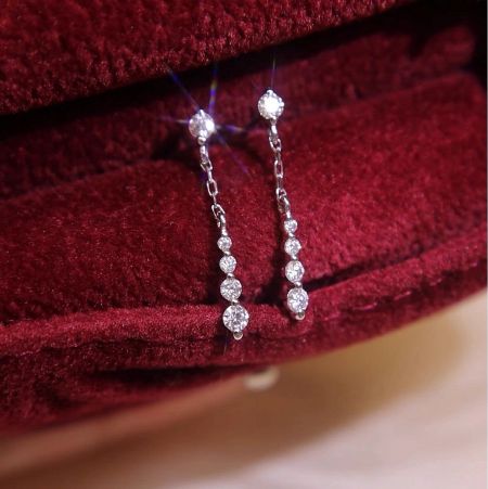 Wholesale 925 Sterling Silver 18k White Gold Plated CZ Chain Drop Dangle Earrings (5 Pairs) - A pair of wholesale 925 sterling silver chain drop dangle earrings with sparkling cubic zirconia, plated in 18k white gold, displayed elegantly on a red velvet box.