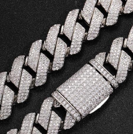 Detailed view of the diamond-encrusted clasp on a custom Cuban link bracelet.