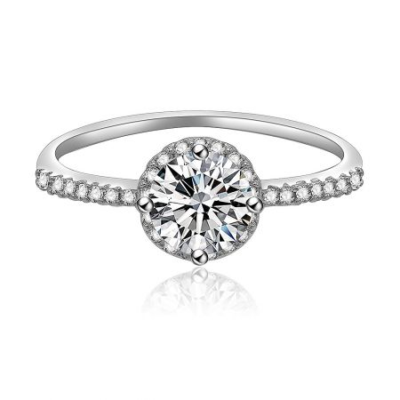 Round Brilliant Halo Engagement Ring - A close-up of the Round Brilliant Halo Engagement Ring, showcasing the central 5mm cubic zirconia stone surrounded by a halo of smaller stones on a rhodium-plated band.