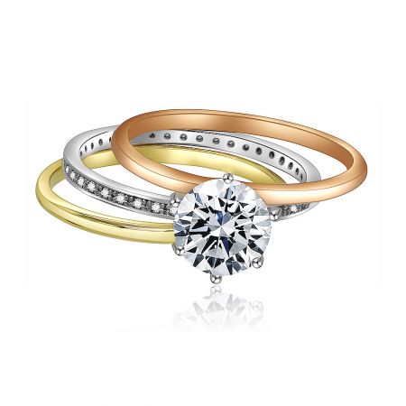 The Three Tone CZ Solitaire Ring presented as part of an elegant engagement ring set with matching bands.