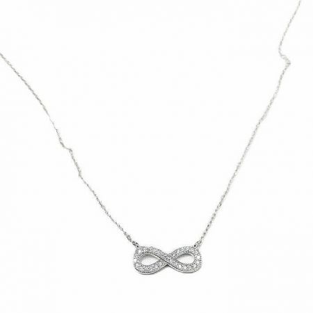 Detailed view of the sterling silver infinity pendant, encrusted with sparkling cubic zirconia.