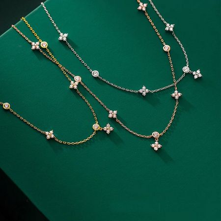 925 Sterling Silver Four-Leaf Clover Charm Necklace Set - A stunning collection of 925 sterling silver four-leaf clover necklaces, showcasing both gold and silver options against a clean background.