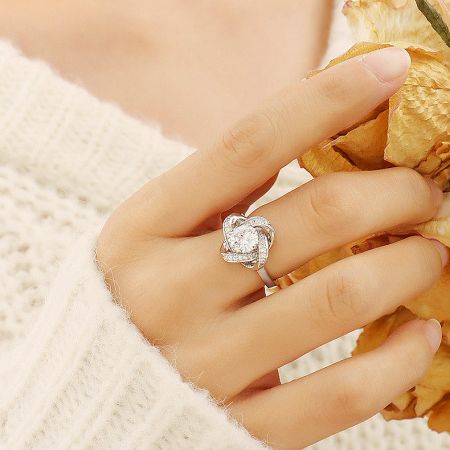 A detailed view of the sterling silver clover ring, highlighting the sparkling central stone.