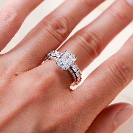 A model wearing the radiant-cut CZ engagement ring to showcase its elegant fit and sparkle.