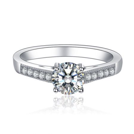 Round Clear CZ Vintage Engagement Ring - A vintage-style 925 sterling silver engagement ring featuring a prominent round clear cubic zirconia centerpiece with detailed side accents.