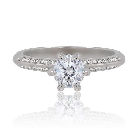 Romantic Love Eternity Ring - Close-up of the Romantic Love Eternity Ring, showcasing a central round cubic zirconia stone with smaller stones encrusted along the rhodium-plated brass band.