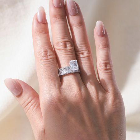 Detailed view of the radiant-cut CZ engagement ring, highlighting the intricate craftsmanship and baguette side stones.