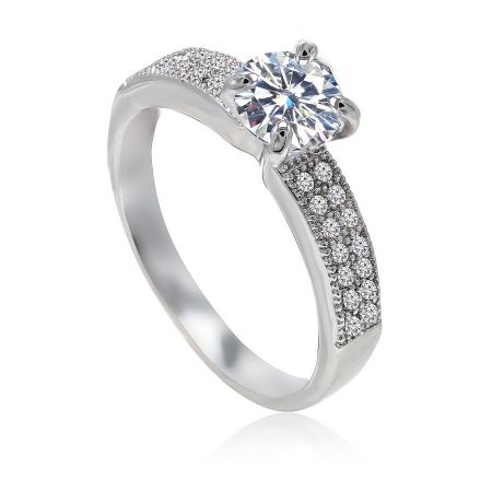 Angled view of the Past And Future Set ring, showing the large central stone and smaller stones on the band.