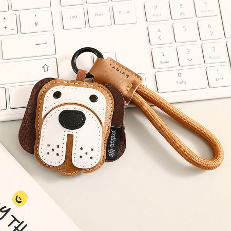 Detailed shot of the brown Beagle-style leather keychain.