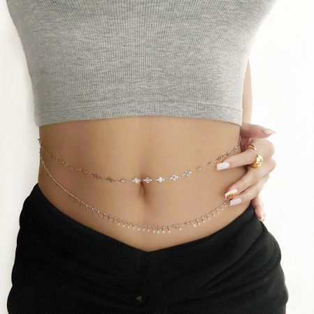 Close-up of a model wearing the double-layered silver Bohomia waist chain, showing its intricate design.