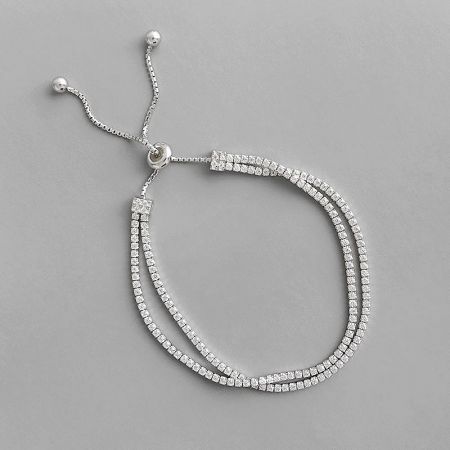 Close-up view of the double-strand silver tennis bracelet, detailing the square-cut cubic zirconia stones.