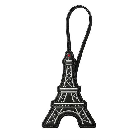 Custom leather purse charm designed as the Eiffel Tower.