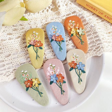 Girls Fabric Embroidered Floral Hair Snap Clips (5 Sets) - A collection of colorful fabric embroidered floral hair snap clips for girls, displayed on a clean white background.