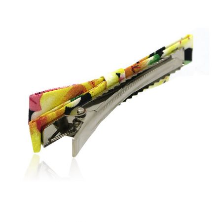 Back view of the yellow floral hair pin showcasing the nickel-free metal clip.