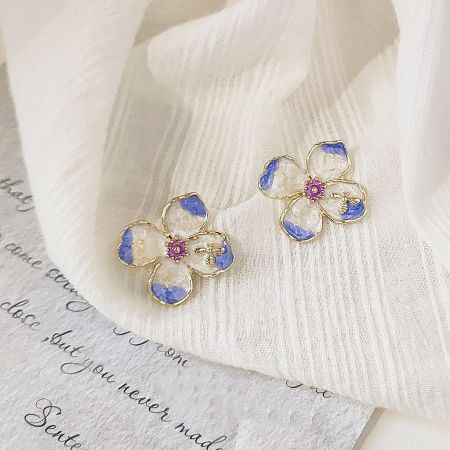 French Style 14k Gold Enamel 4-Petal Flower Stud Earrings (5 Pairs) - A pair of French style 4-petal flower stud earrings with gold outlines, white and blue enamel petals, and pink centers.