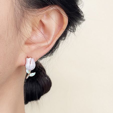 Model wearing the gradient enamel tulip flower stud earring, showcasing its size and appearance.