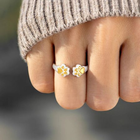 A product shot of the sterling silver paw print ring, an ideal memorial or birthday gift for pet owners.