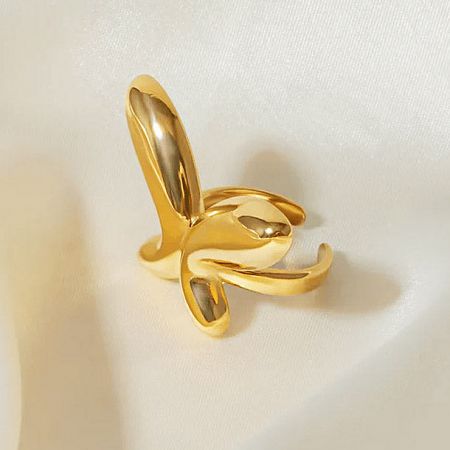 Detailed product shot of the abstract geometric gold ring.
