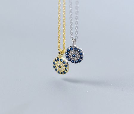 Comparison of the Evil Eye necklace in both gold and silver finishes, highlighting the versatile style options.