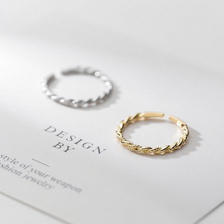 Stylish presentation of the adjustable gold and silver rope rings.