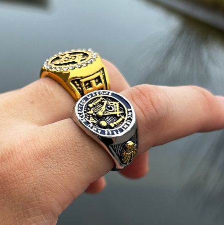 Gold and silver variations of the Crystal Masonic Ring, highlighting the intricate design details and material options.