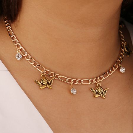 Another angle of the gold angel charm necklace, highlighting the intricate details and gemstones.
