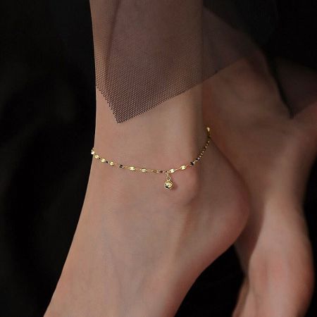 925 Sterling Silver Anklet for Women Summer Beach Jewelry Set of 5 - A close-up of a 925 sterling silver anklet in a gold tone, featuring a minimalist cat-shaped charm with a central blue cubic zirconia stone.