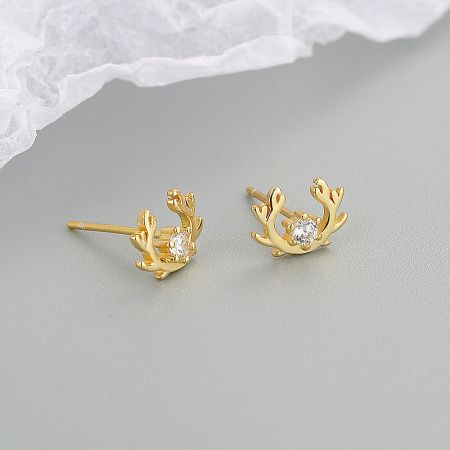 A pair of gold antler stud earrings with clear zircon gemstones shown against a white background.