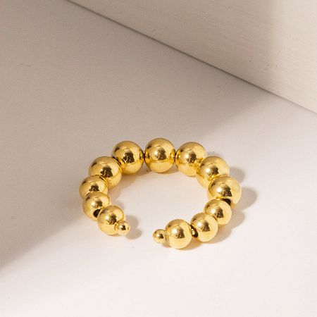 Gold beaded bracelet on a white background.