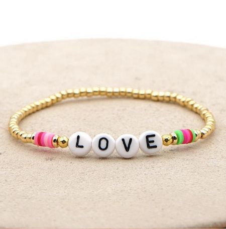Close-up of the 'LOVE' beaded letter bracelet with gold and colorful beads.